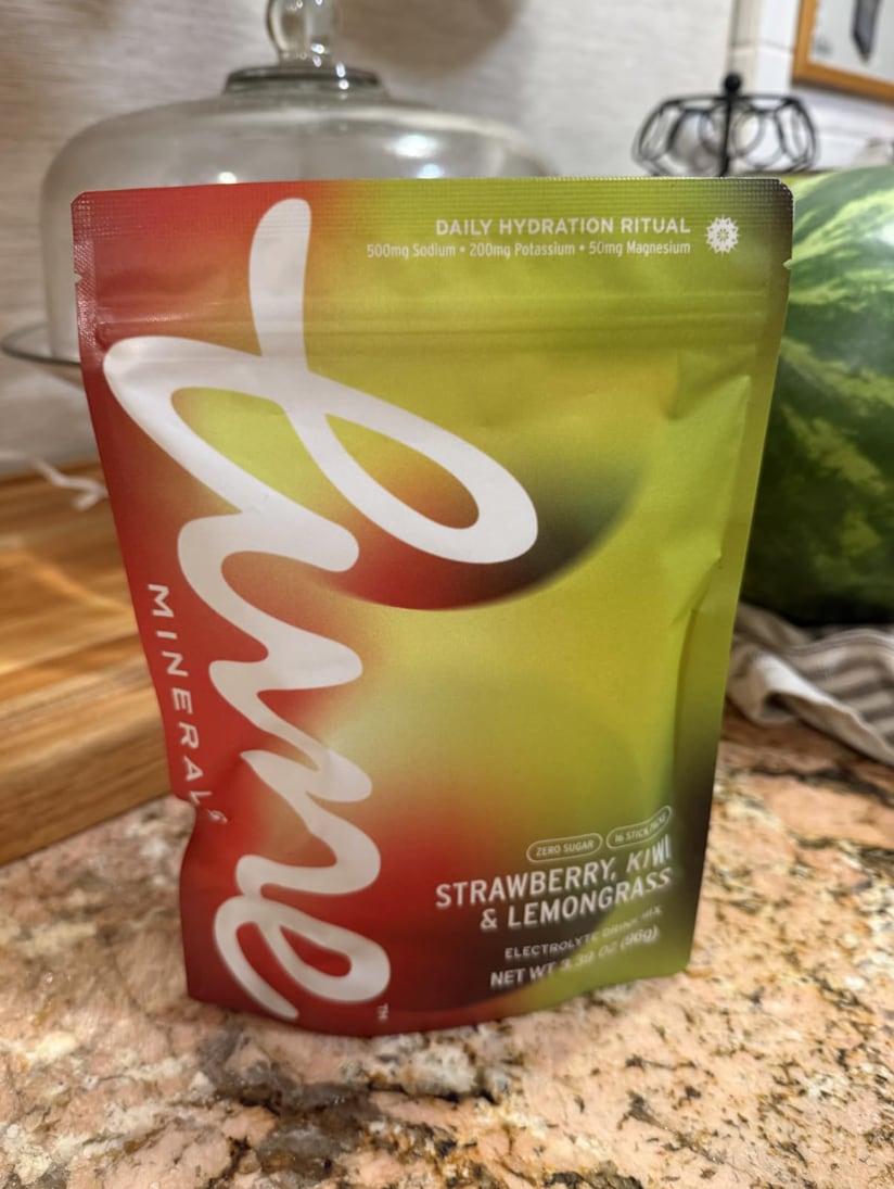 Customer photo: a Strawberry, Kiwi & Lemongrass pouch on a granite kitchen counter