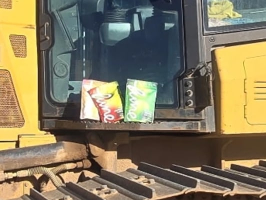 Customer photo: Lune pouches on the dash of a bulldozer cab at a jobsite